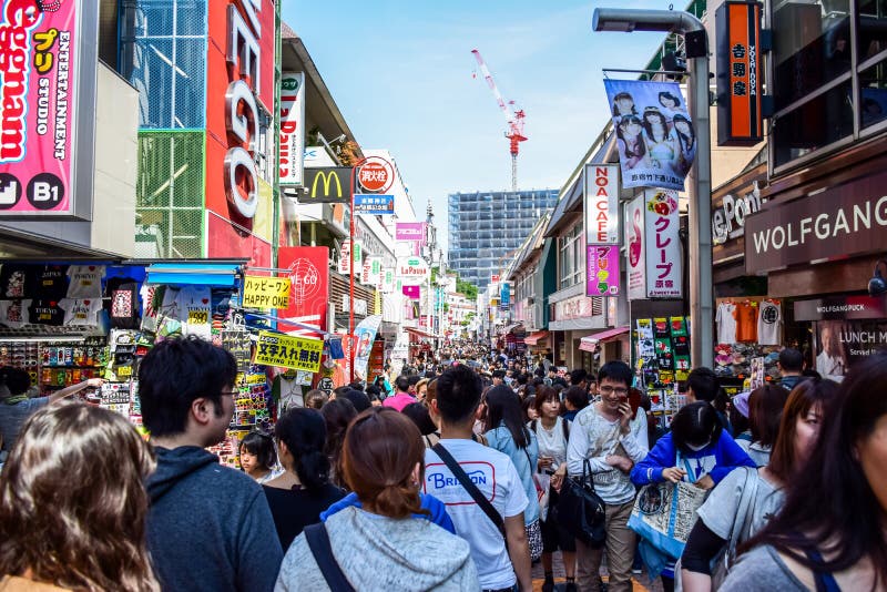 TOKYO, JAPAN: People are shopping at Takeshita street, a famous shopping street lined with fashion boutiques, cafes an stock photo